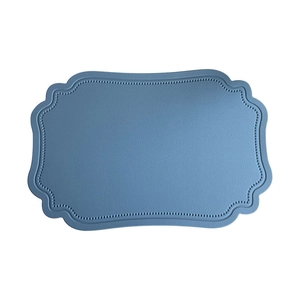Blue Nordic waterproof faux leather placemat with textured bead edge and wavy contour