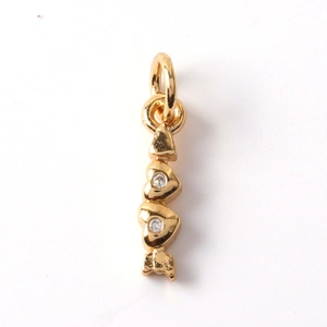 Detailed view of 14K gold plated heart and arrow pendant with sparkling zircon accents