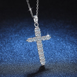 S925 sterling silver cross pendant necklace with sparkling moissanite stones on blue back