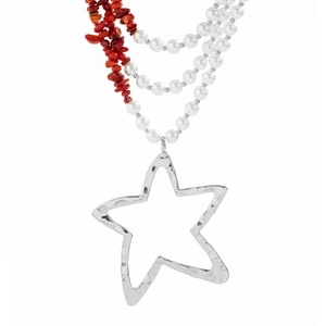 Macro detail of multi-layer beaded necklace with hammered silver star pendant