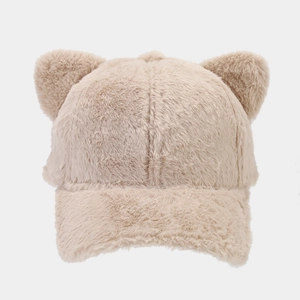 Close-up of the soft plush fabric and cute 3D bear ear design on a winter baseball cap
