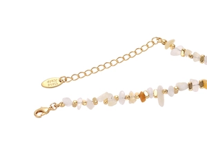 Macro shot of 18K gold plated clasp and natural stones with Hand Made tag detail