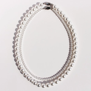 Classic double-layer white pearl necklace with glossy finish and elegant silver metal clasp