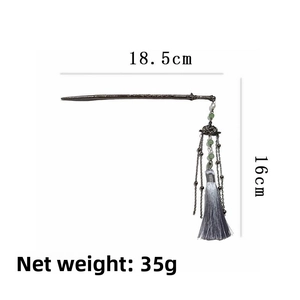 Detail view of lotus sword hair pin with grey tassel and dimensions of 18.5cm by 16cm