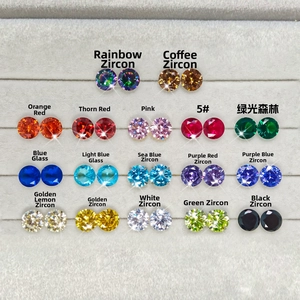 Close-up of 17 colors of round-cut cubic zirconia and glass stones in a velvet tray