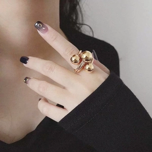 Exaggerated gold irregular planet ring for women featuring polished 3D stacked spheres