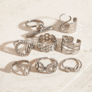 Set of 8 minimalist silver stainless steel rings with geometric and woven textures