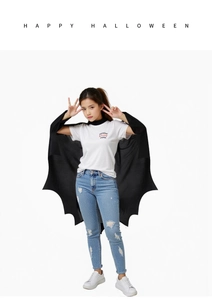 Kids black bat wing cape for Halloween party costume with Happy Halloween text overlay