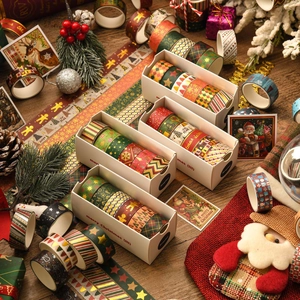 Christmas washi tape set with gold foil patterns in festive red and green gift packaging