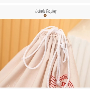 Detail view of cotton drawstring closure on beige canvas Christmas gift sack