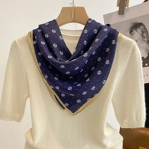 Elegant navy blue printed silk scarf with white leaf patterns and khaki borders