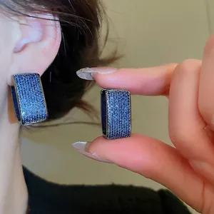 U-shaped double layer earrings with sparkling blue zircons in a vintage silver finish