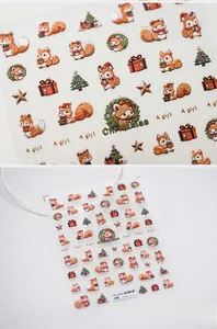 Macro detail of 3D Christmas nail stickers with squirrels, trees and festive patterns