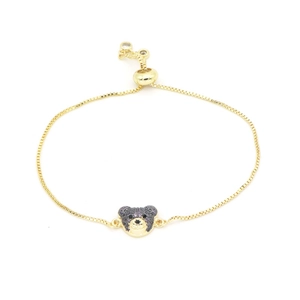 Adjustable gold chain bracelet with a bear pendant featuring dark zircon stones