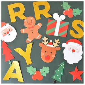 Close-up of glittery Christmas banners featuring Santa Claus, reindeer, and letters