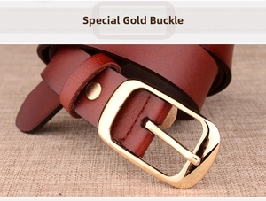 Detail of burgundy leather belt with a polished gold-tone metal buckle on linen fabric