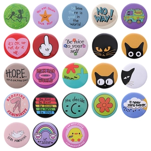 Assorted collection of creative round tinplate badges with cat and slogan designs