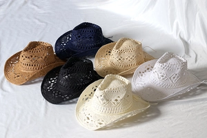 Detail of hand-woven hollow knit straw cowboy hats in six assorted vintage colors
