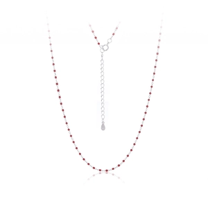 Macro shot of 925 sterling silver stamp on necklace with small red beads and spring clasp