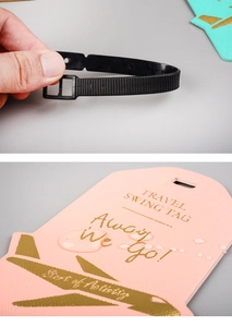 Close-up of pink faux leather luggage tag with waterproof surface and airplane icon