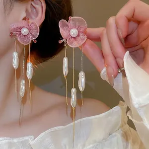 Pink fabric flower earrings with long gold tassels and baroque pearls for beach vacations
