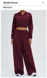Detail view of the deep wine purple hoodie and high-waisted wide-leg sports set