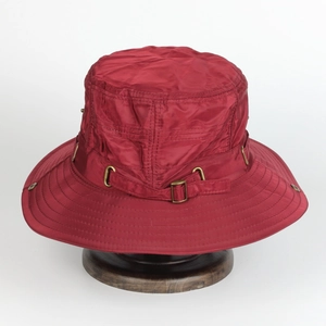 Detail view of burgundy wide brim sun hat with reinforced stitching and metal buckle