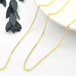 Macro shot of minimalist gold S925 sterling silver O-link chain with fine oval ring texture