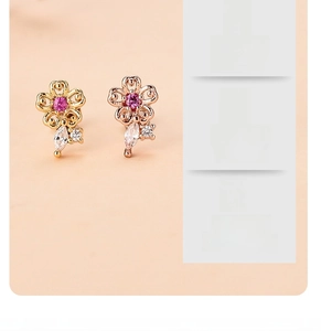 Detail of pink floral earrings with 18K gold plating and sparkling zircon stones