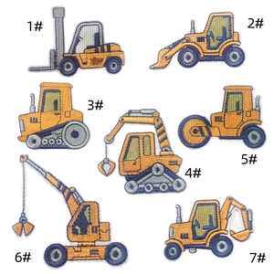 Detailed embroidery texture of yellow construction vehicle patches for clothing