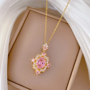 Elegant gold necklace featuring a luxury pink diamond pendant in a vintage palace style