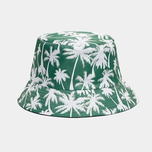 Close-up of dark green bucket hat with white coconut tree prints and neat stitching