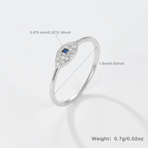 Detailed view of silver evil eye ring with blue sapphire stone and diamond accents