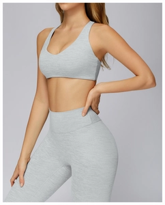 Detail shot of light grey heathered sports set with high-waisted leggings and v-neck bra