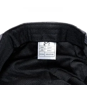 Detail view of quick-dry nylon newsboy cap interior featuring mesh and wash label