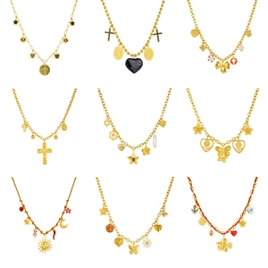 Collection of nine gold necklaces featuring star, heart, and butterfly charms