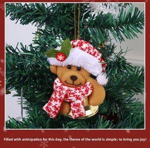 Plush Christmas bear ornament with red checkered hat and golden bell on tree