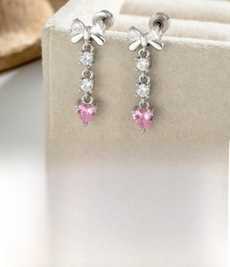 Detail of silver bow tassel earring with pink zircon and screw back piercing specifications