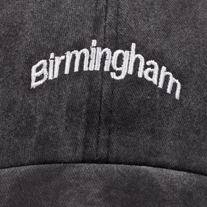 Washed dark gray cotton baseball cap with white birmingham embroidery in vintage style