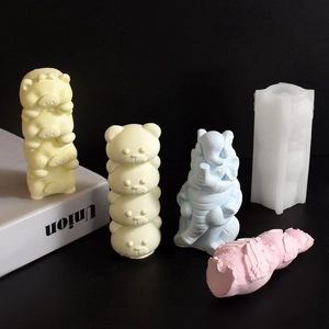Macro view of animal silicone molds and colorful owl-bear shaped plaster crafts
