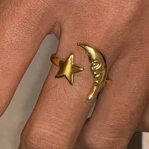 Minimalist 18k gold stainless steel open ring featuring star and moon face design