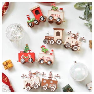 Detailed view of wooden Christmas train decor with snowman and tree on white background