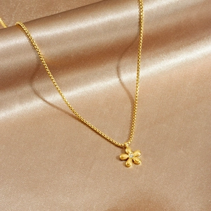 Golden stainless steel flower pendant necklace with diamond on champagne satin