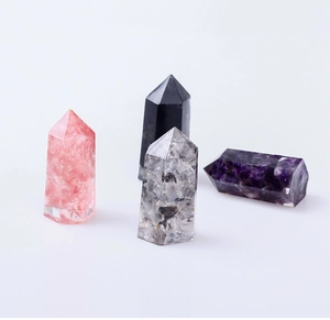 Set of four polished natural crystal pillars in pink black white and purple tones