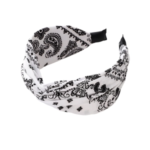 Fashionable black and white paisley printed knotted headband with wide fabric design