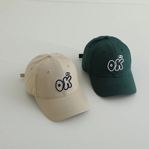 Detailed embroidery of OK and good letters on cotton twill baseball caps for kids