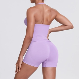 Detail view of lavender seamless yoga set showing open back top and ribbed high-waist shorts