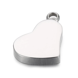 Macro shot of silver stainless steel heart pendant with smooth finish and top ring
