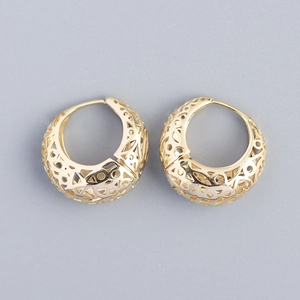 Close-up of golden hollow pattern earrings in S925 sterling silver with elegant details