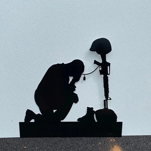 Detail of metal soldier silhouette grave marker with ALWAYS REMEMBER text cutout